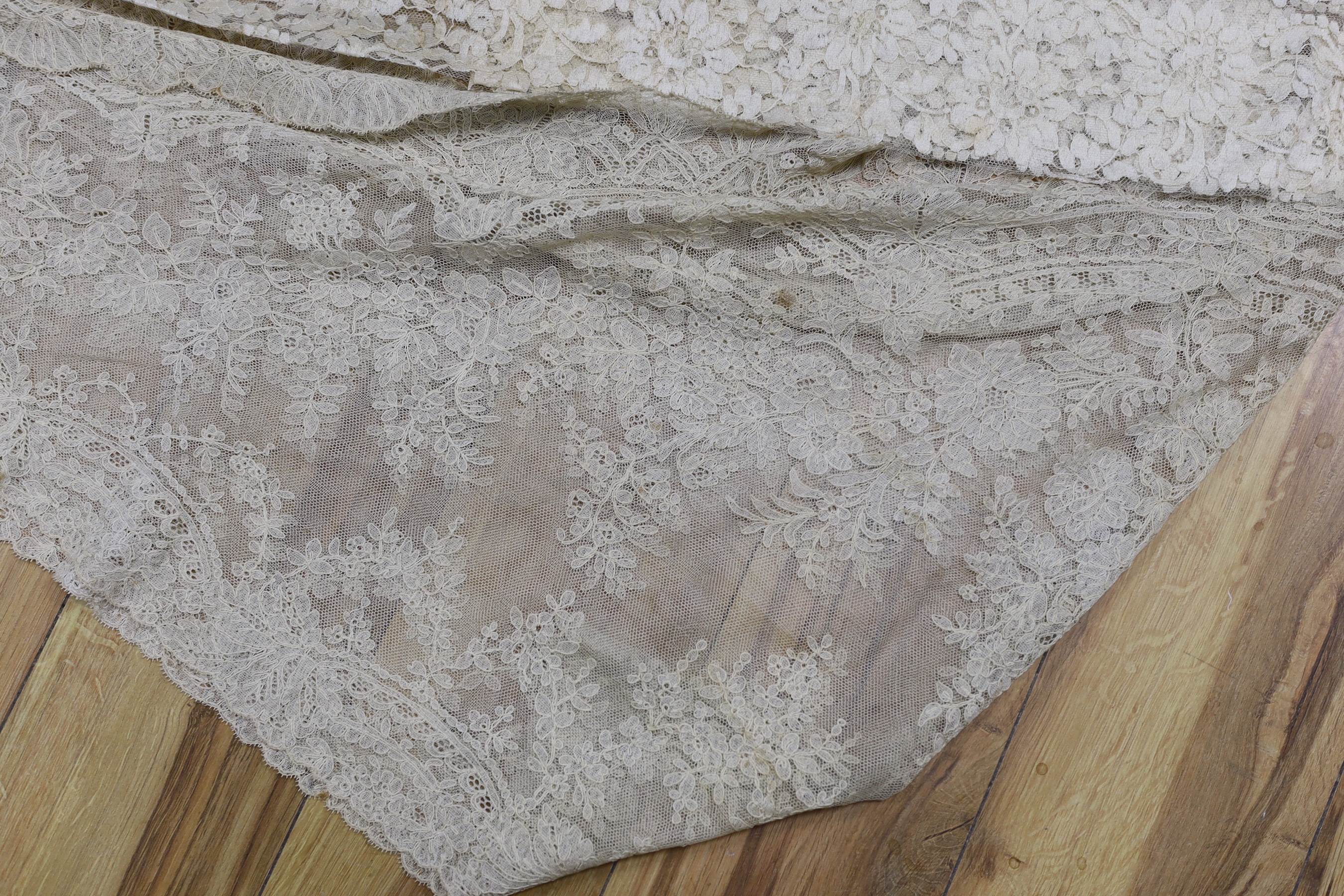 Two pieces of machine lace and a Honiton lace table mat
